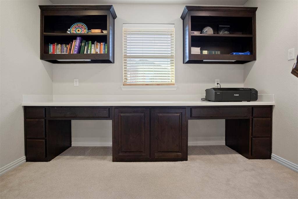 Study nook with wonderful built ins and a window