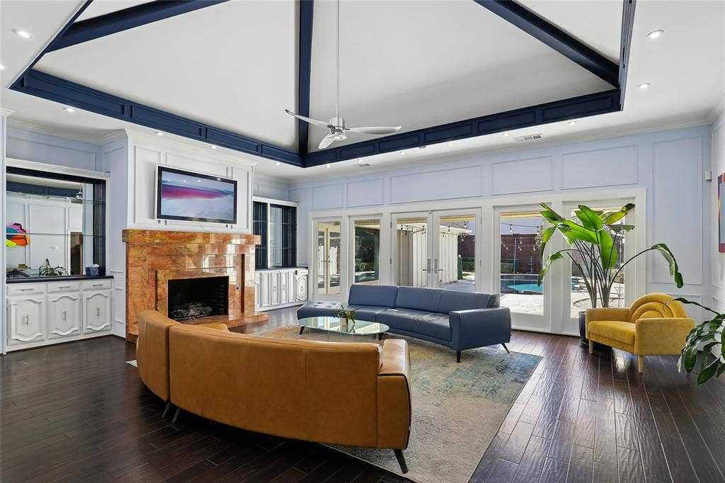 5716 Plumtree Drive, Dallas, TX 75252 Located just past the grand entry, the living room provides a great place to entertain guest, or just sit back and relax. A wall of window provides great view of the patio and pool and offers abundant natural light.