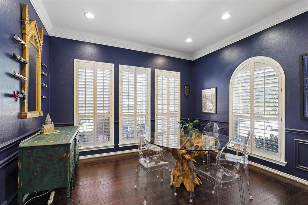 5716 Plumtree Drive, Dallas, TX 75252 Dark wood-finish flooring, recessed lighting, and crown molding