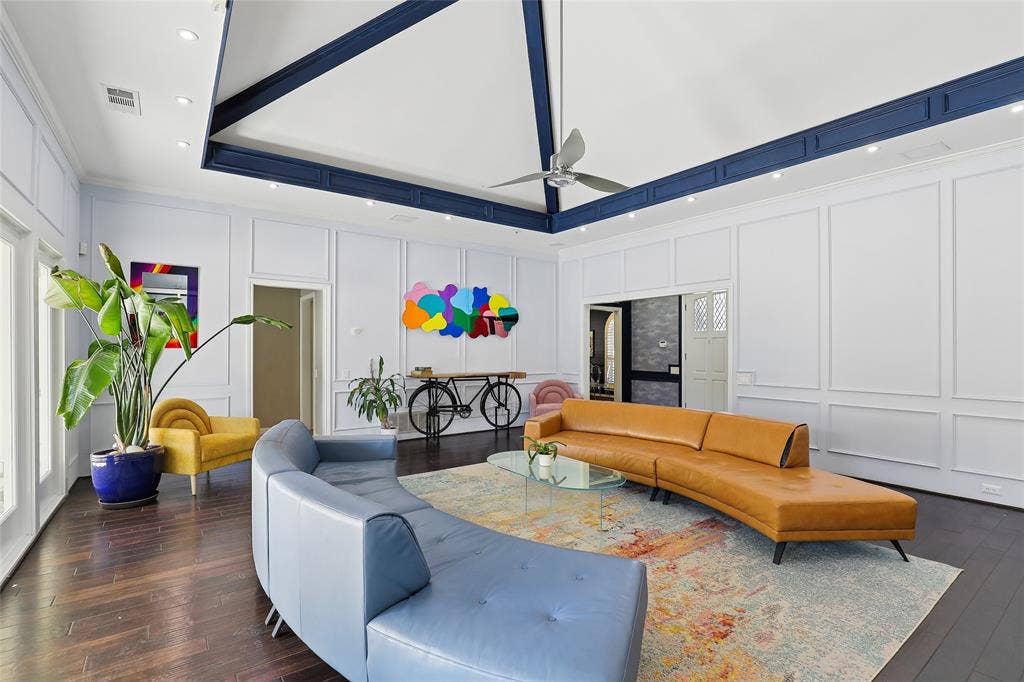 5716 Plumtree Drive, Dallas, TX 75252 Not an old stuffy living room. This serves as the hub of the home, connecting to the pool and patio as well as the private bedroom areas, kitchen, bar, and dining room.