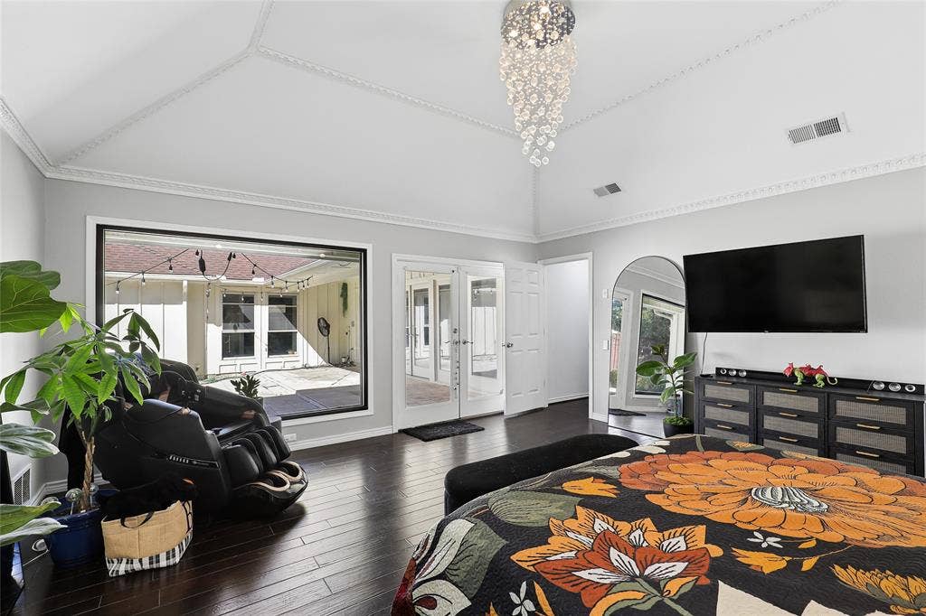 5716 Plumtree Drive, Dallas, TX 75252 Oversized fish-bowl window allows for abundant light. The adjoining double glass doors Vaulted ceiling with crown molding, dark wood-finish flooring, large picture window, and double French doors opening to the patio offer quick access to the pool and spa.