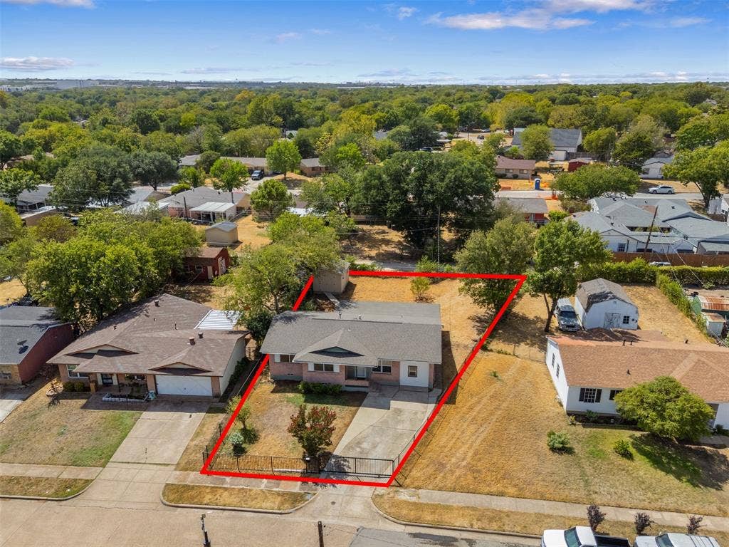 2563 Wood Valley Drive, Dallas, TX 75211 Single-story residence featuring a gabled roof and an attached garage