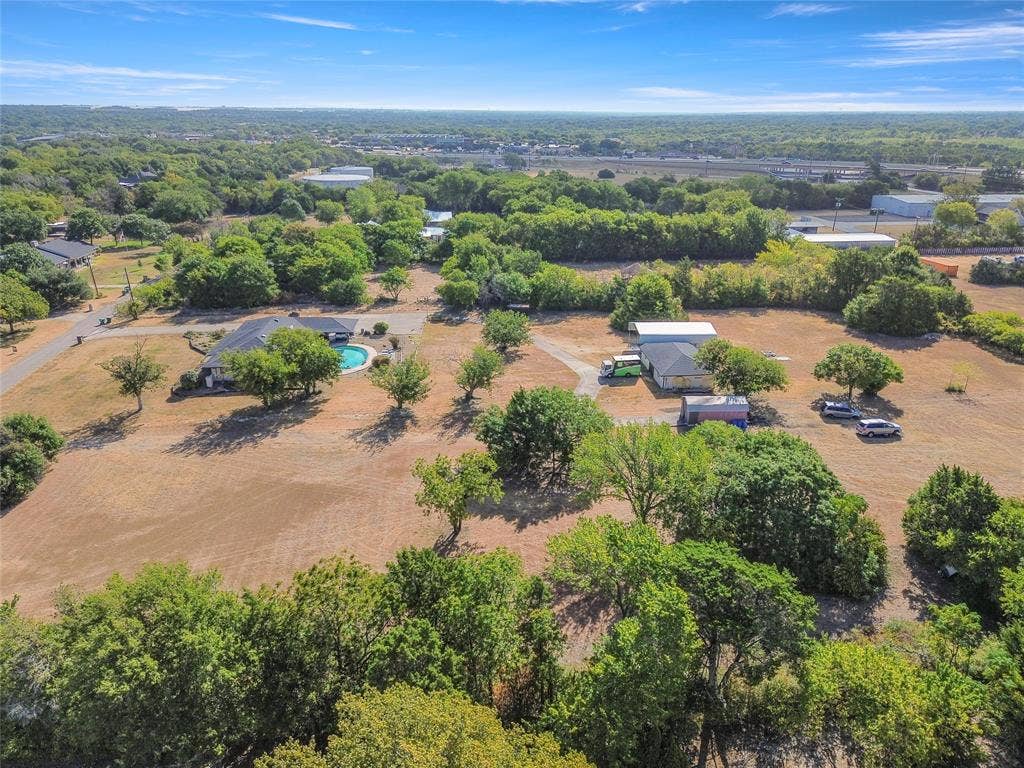 1022 Sherman Drive, Cedar Hill, TX 75104 Expansive property featuring multiple structures, a private pool, and mature trees across a substantial land area