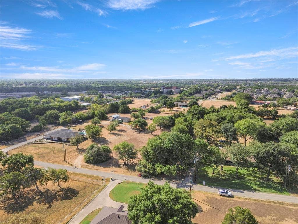 1022 Sherman Drive, Cedar Hill, TX 75104 Expansive undeveloped land with scattered mature trees and residential structures