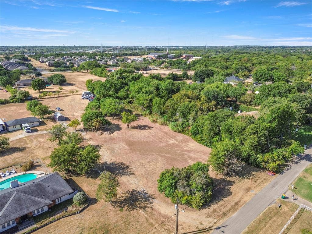 1022 Sherman Drive, Cedar Hill, TX 75104 Cleared land parcel with mature trees and paved road frontage