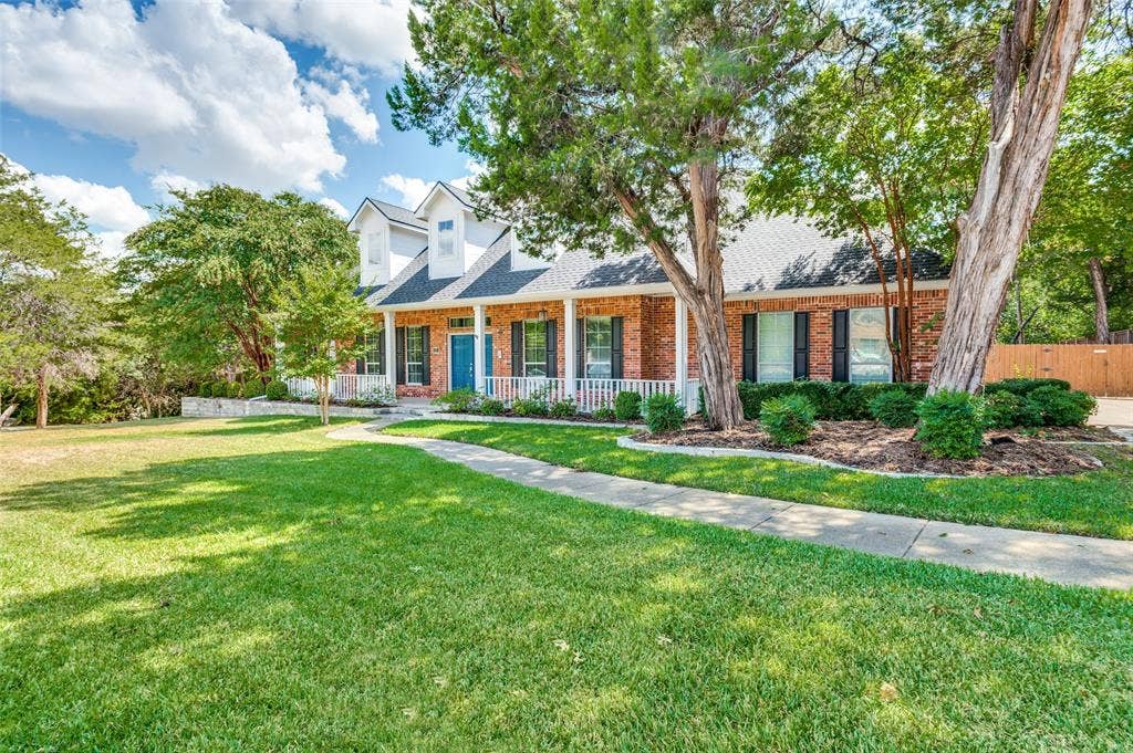 806 Cobblestone Court, Cedar Hill, TX 75104 Brick exterior with white siding accents and dormer windows
