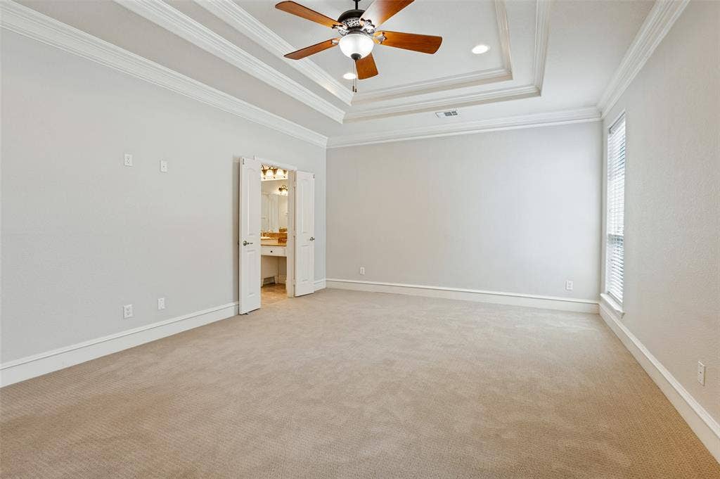 806 Cobblestone Court, Cedar Hill, TX 75104 Spacious room featuring tray ceiling with a ceiling fan, recessed lighting, carpeted flooring, and a window with blinds