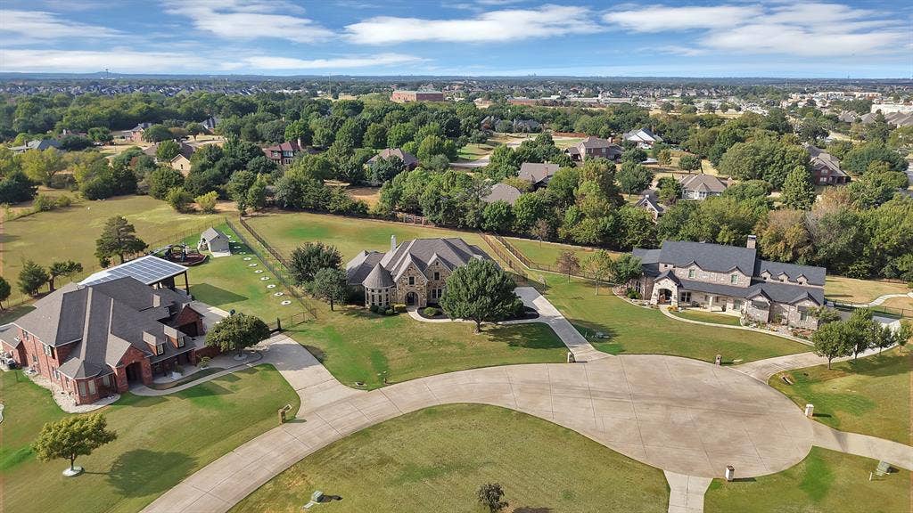 Expansive property featuring a large residence with a multi-gabled roof