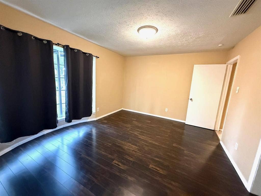 2705 Tanglewood Drive, Lancaster, TX 75134 Wood-finish flooring with a smooth finish, neutral wall tones, and recessed lighting