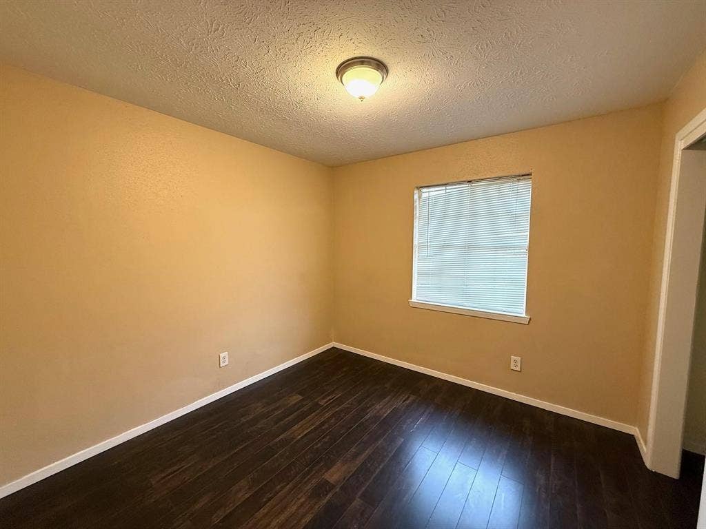 2705 Tanglewood Drive, Lancaster, TX 75134 Wood-finish flooring, single window with blinds, ceiling-mounted light fixture