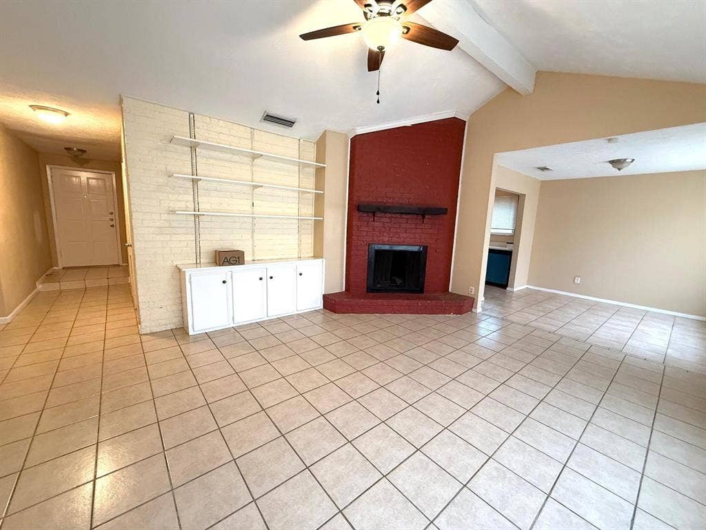 2705 Tanglewood Drive, Lancaster, TX 75134 Vaulted ceiling with exposed beams, ceiling fan, and tiled flooring
