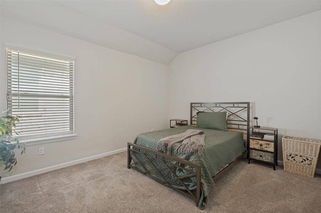 632 Cherry Hills Road, Red Oak, TX 75154 Neutral tone carpet flooring with white walls and a single window with blinds