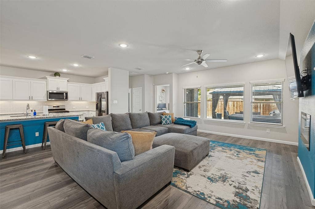 632 Cherry Hills Road, Red Oak, TX 75154 Open-concept living area featuring wood-finish flooring, recessed lighting, and a ceiling fan