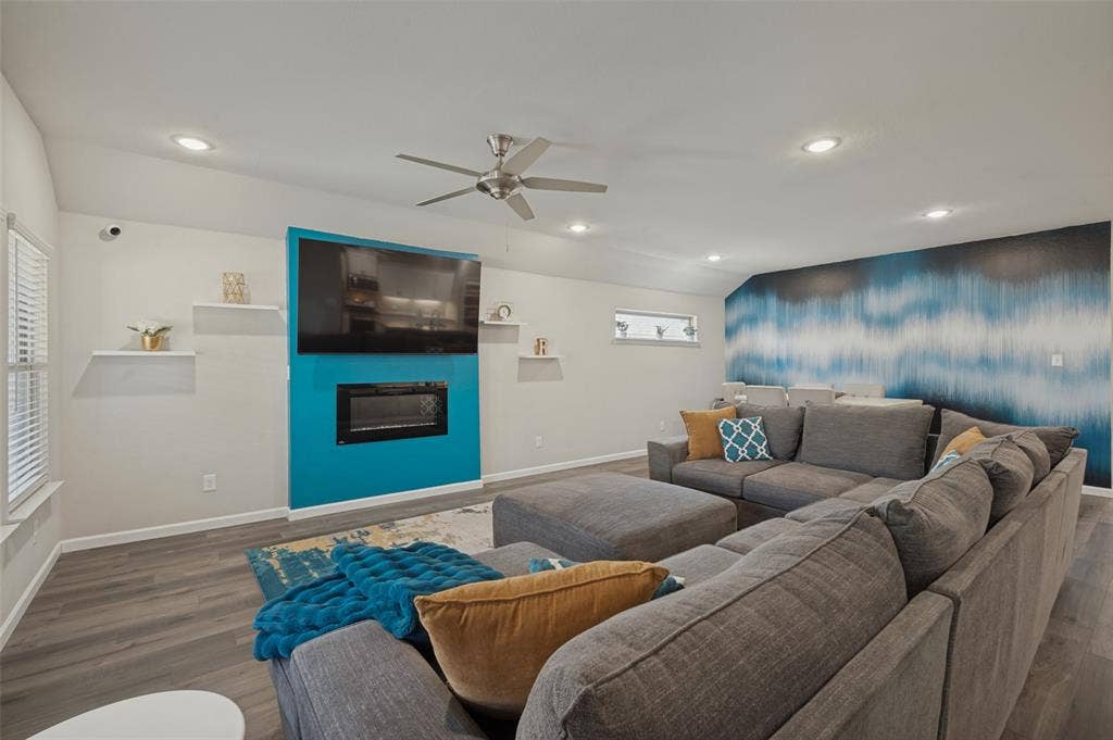 632 Cherry Hills Road, Red Oak, TX 75154 Vaulted ceiling, recessed lighting, wood-finish flooring, built-in fireplace, and a ceiling fan