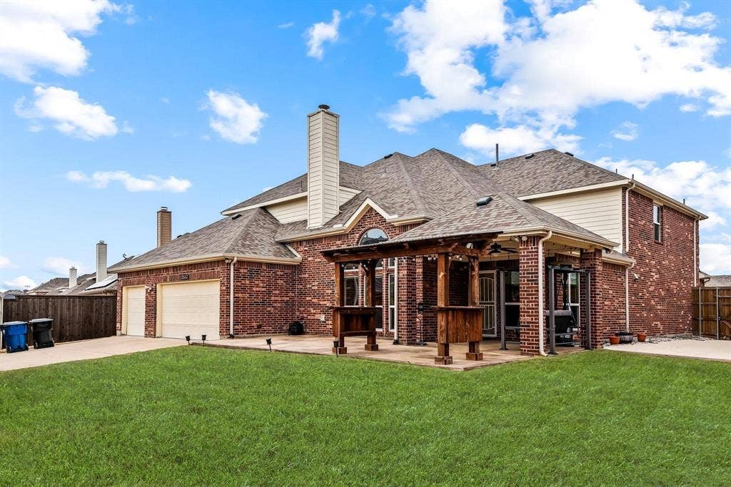 12467 Fallcreek Drive, Frisco, TX 75035 Brick exterior with a covered patio and pergola