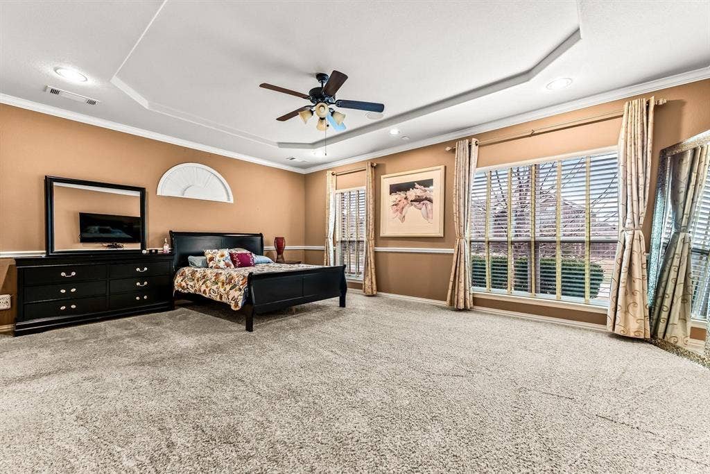 12467 Fallcreek Drive, Frisco, TX 75035 Recessed lighting, ceiling fan, tray ceiling, carpeted flooring, and large windows with blinds