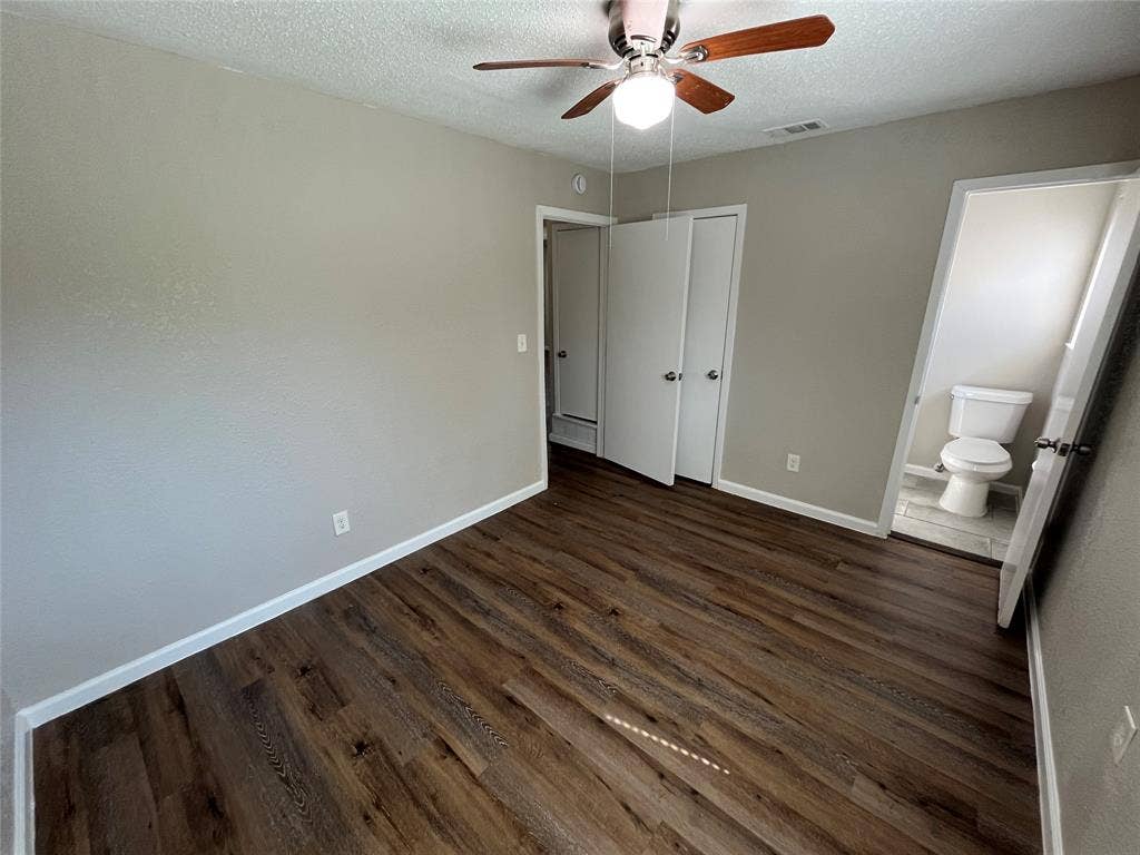 14206 Osage Drive, Balch Springs, TX 75180 Wood-finish flooring throughout, ceiling fan with integrated lighting, and neutral wall tones