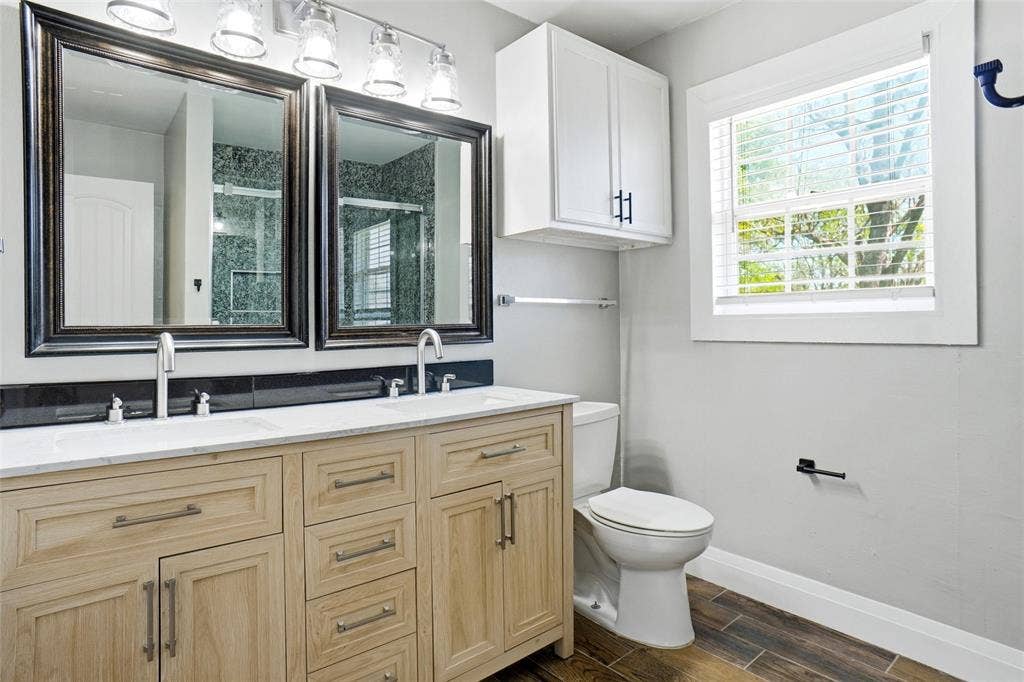 705 Vine Street, Euless, TX 76040 remodeled hall bath with duar sinks, medicine cabinet, new vanity, lights & mirrors