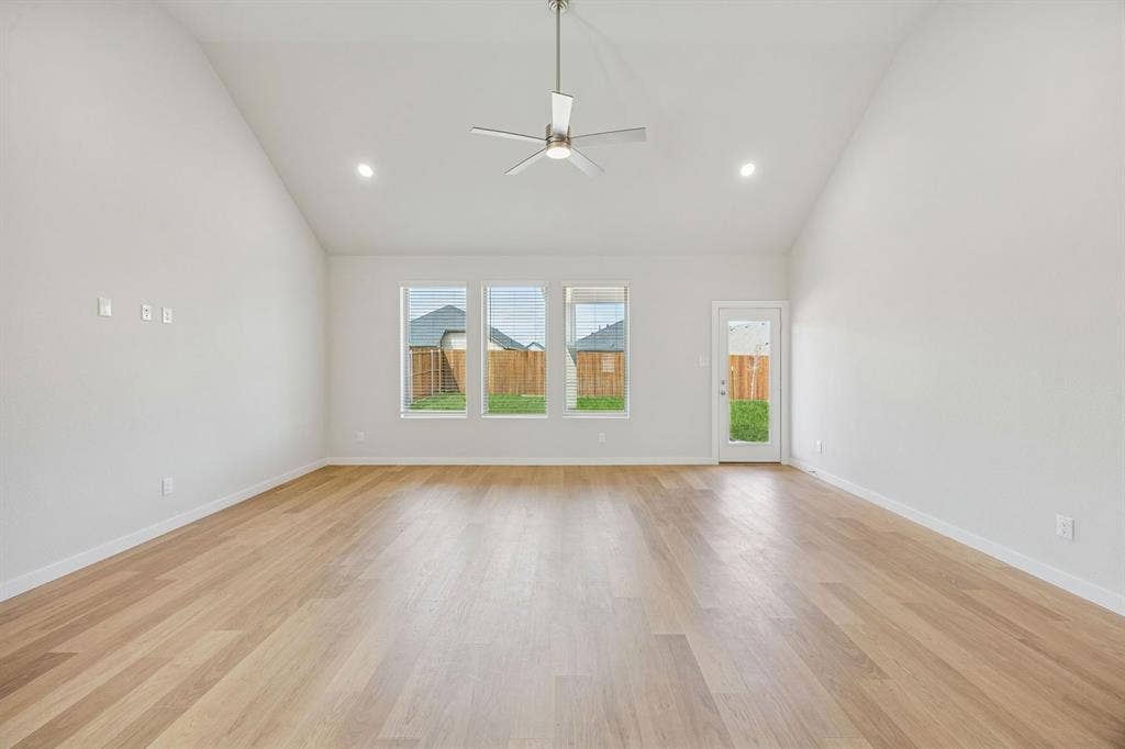 449 Hocking Hills Drive, Waxahachie, TX 75165 Living Room in the Stanley II home plan by Trophy Signature Homes – REPRESENTATIVE PHOTO