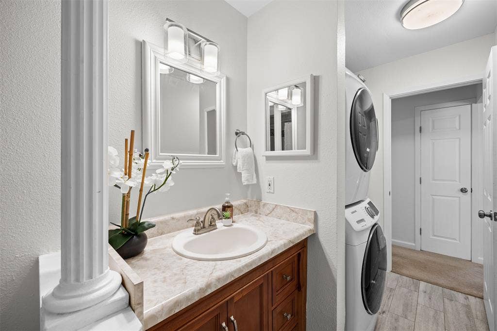 1118 Pacific Drive, Richardson, TX 75081 Bathroom vanity with an integrated sink and an ornamental column