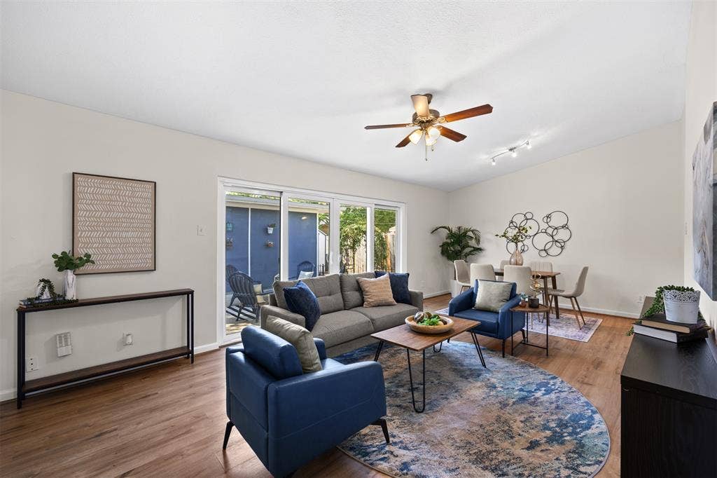 1118 Pacific Drive, Richardson, TX 75081 Wood-finish flooring throughout, vaulted ceiling, and a ceiling fan with integrated lighting