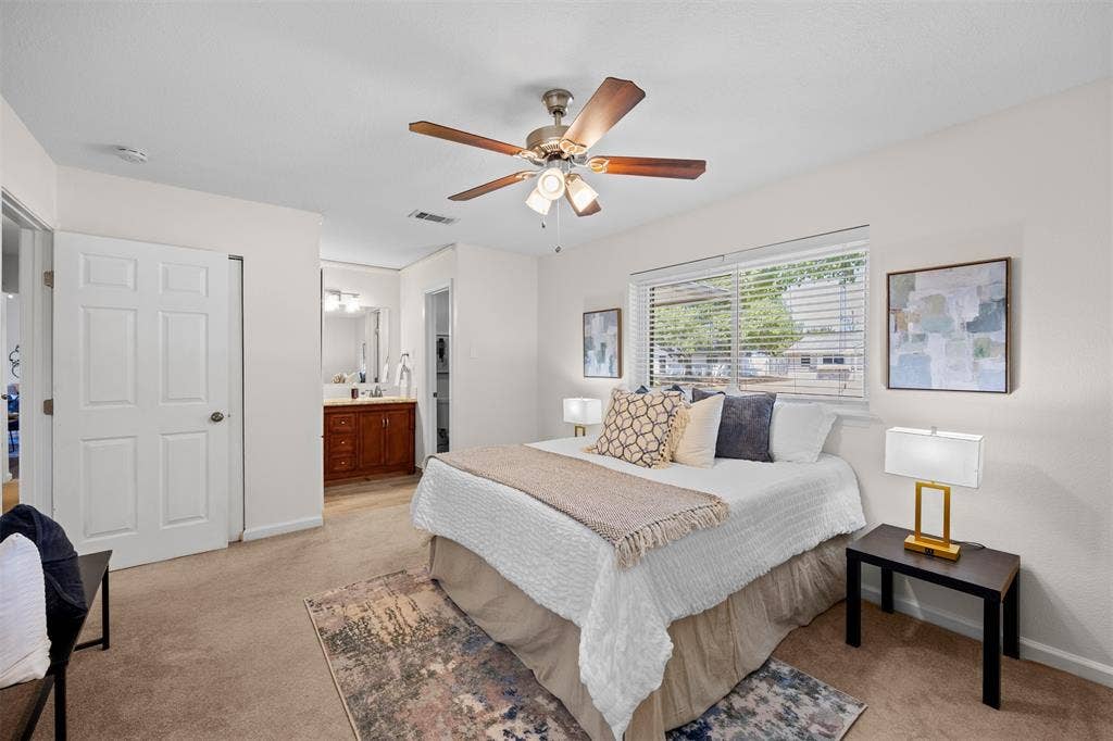 1118 Pacific Drive, Richardson, TX 75081 Bedroom featuring a ceiling fan with light fixture, window with blinds, and carpet flooring