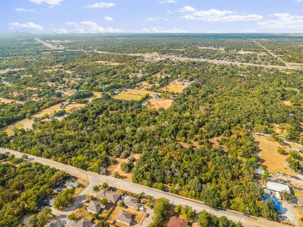 19 No Name Street, Dallas, TX 75217 Expansive 21.18-acre lot with extensive tree coverage, offering proximity to Trinity River Audubon Center (1.5 miles), Trinity Forest Adventure Park (1 mile), and C F Hawn FWY 175