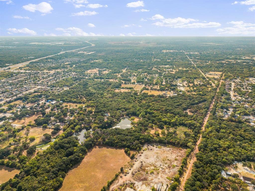 19 No Name Street, Dallas, TX 75217 Expansive wooded terrain with visible water features and distant infrastructure