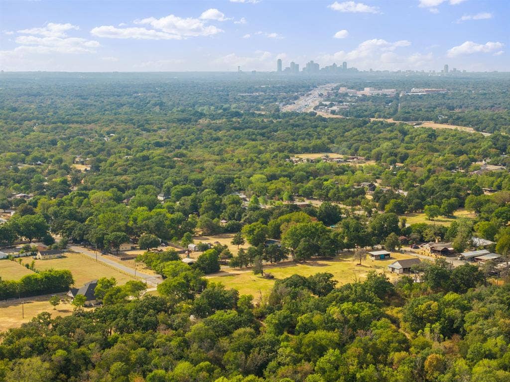 19 No Name Street, Dallas, TX 75217 Expansive tree canopy with scattered homes and a distant urban skyline