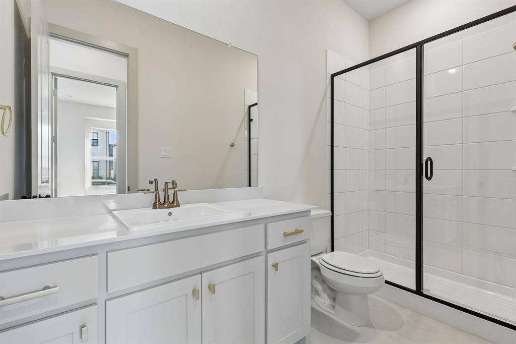 328 Walker Parkway, Celina, TX 75009 Friends and family will feel right at home in any of the beautifully finished guest baths in our Madeleine plan.