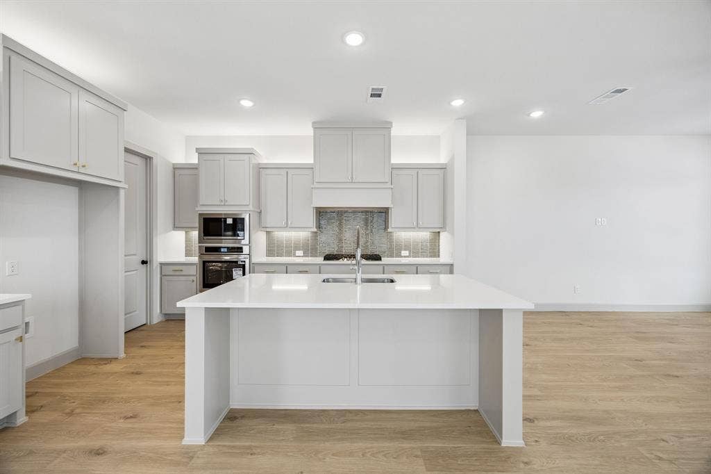 312 Callum Parkway, Celina, TX 75009 Your fantastic new kitchen features an oversized island perfect for friends and family to gather round!