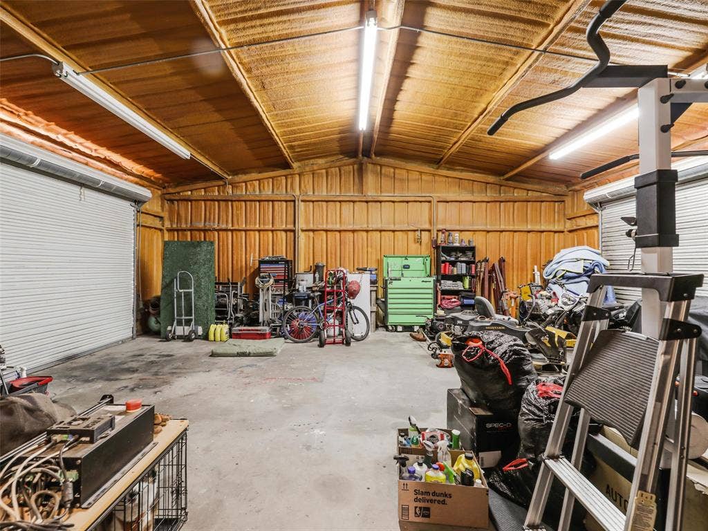 16880 W Fm 455, Celina, TX 75009 Metal building with a concrete floor, corrugated metal ceiling, and fluorescent lighting