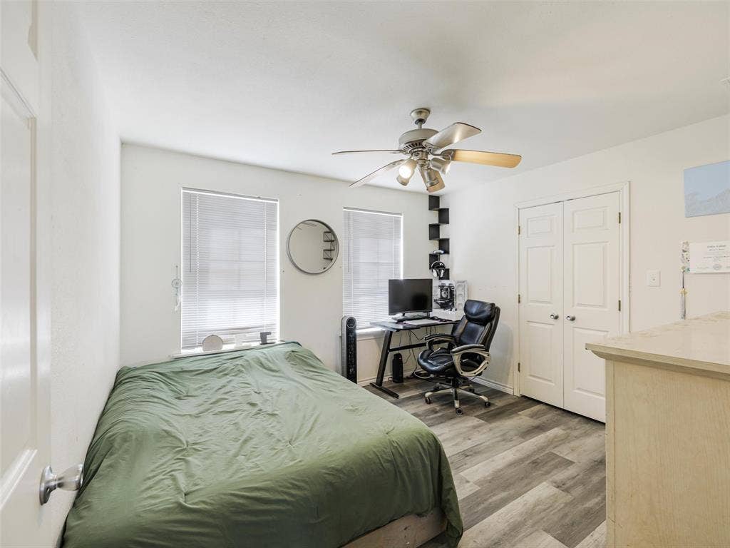 16880 W Fm 455, Celina, TX 75009 Wood-finish flooring, dual windows with blinds, ceiling fan with integrated lighting, and a closet with double panel doors