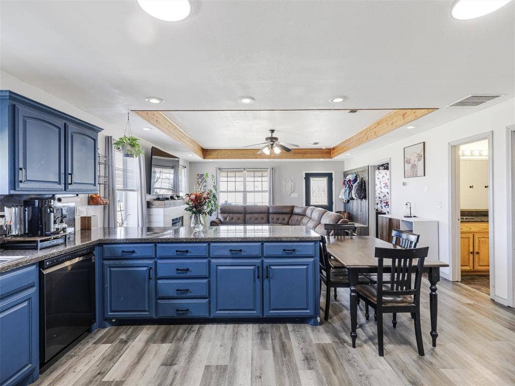 16880 W Fm 455, Celina, TX 75009 Open concept kitchen featuring blue cabinetry, dark countertops, wood-finish flooring, and recessed lighting