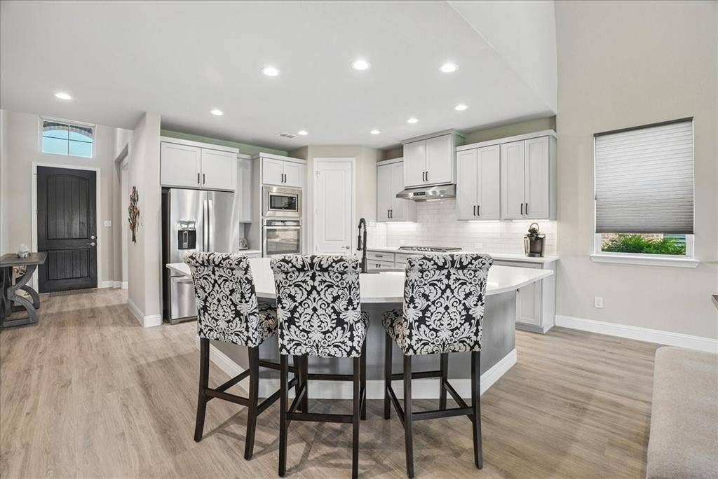 2206 Wellington Lane, Corinth, TX 76210 Large island overlooking beautifully remodeled kitchen.