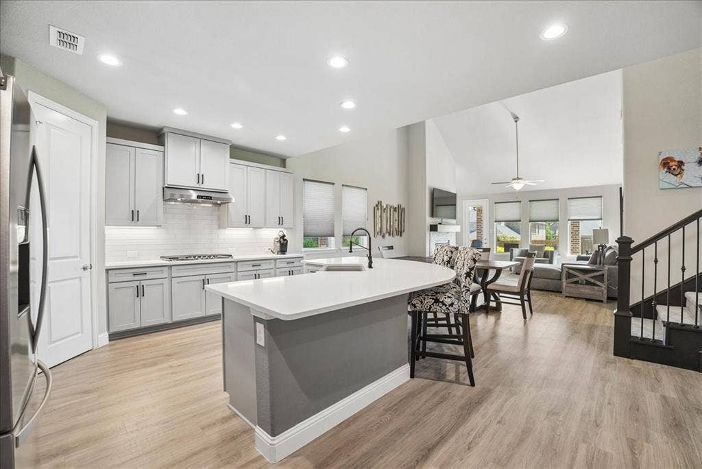 2206 Wellington Lane, Corinth, TX 76210 Beautifully remodeled kitchen with large island, abundant cabinetry and open-concept living.