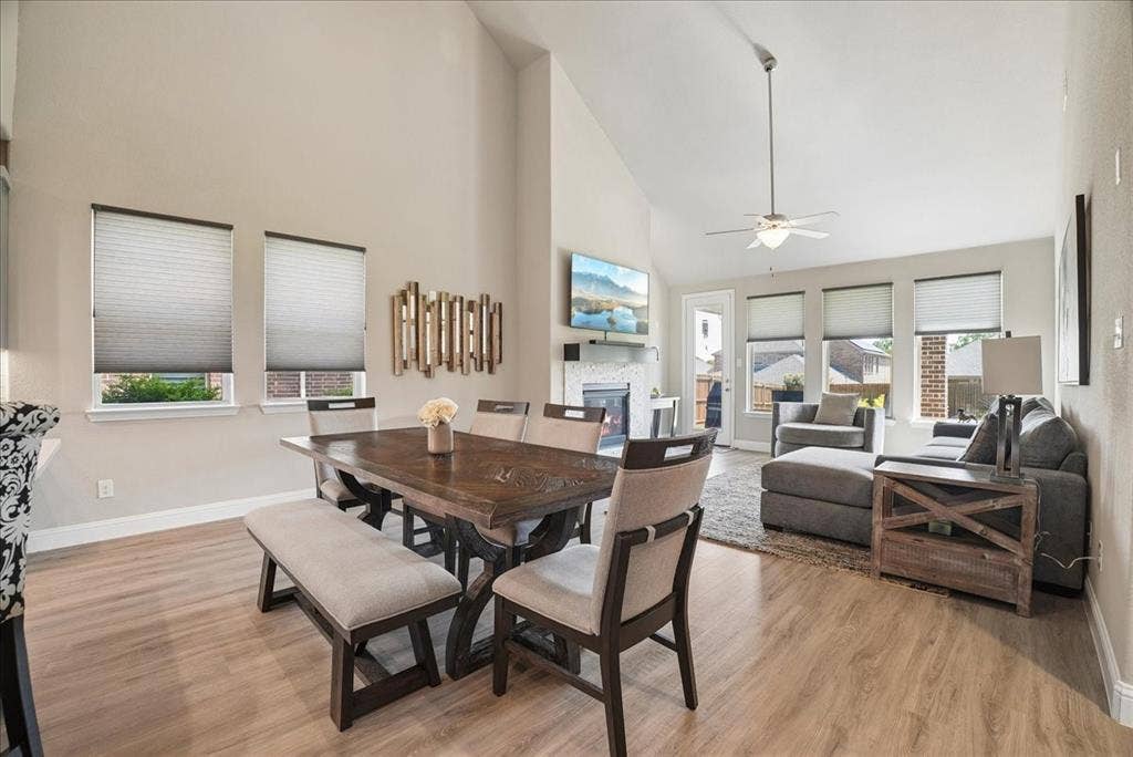 2206 Wellington Lane, Corinth, TX 76210 Spacious dining area flows seamlessly into the bright , open living room.