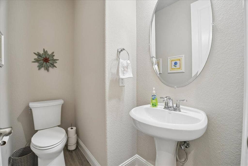 2206 Wellington Lane, Corinth, TX 76210 Convenient first-floor half bath, perfect for guests.