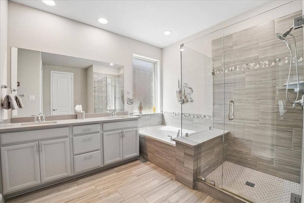 2206 Wellington Lane, Corinth, TX 76210 Primary bath with dual vanity, soaking tub and oversized walk-in shower.