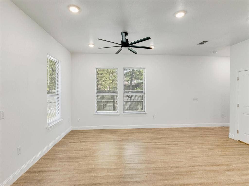 82 Indian Harbor Drive, Mabank, TX 75156 Recessed ceiling lighting, wood-finish flooring, ceiling fan, white wall finishes, and multiple windows