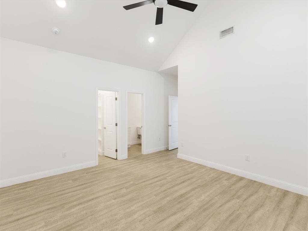 82 Indian Harbor Drive, Mabank, TX 75156 Vaulted ceiling with a ceiling fan, recessed lighting, wood-finish flooring, and white interior doors