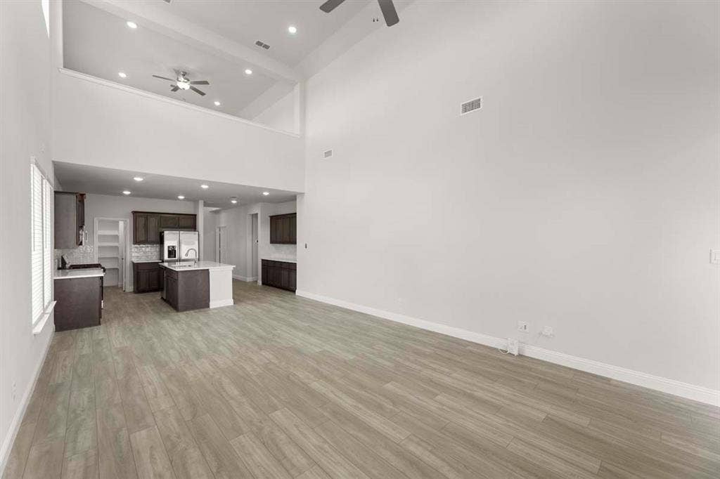 1033 Lovely Day Drive, Lavon, TX 75166 06_1033-lovely-day-lavon-tx-living-room-high-ceiling