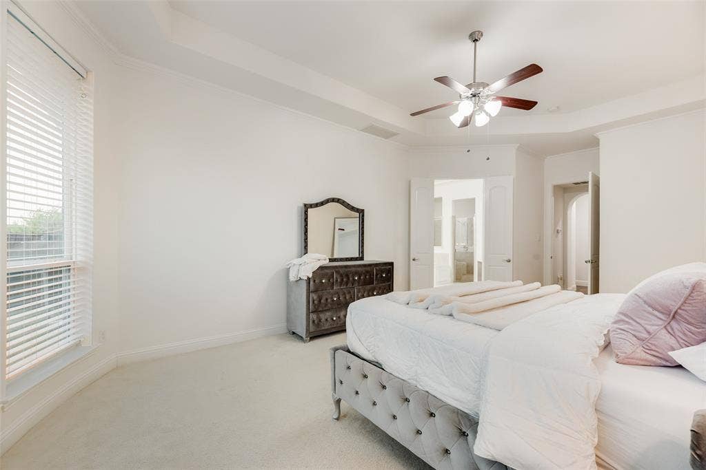 2408 Brisbane Lane, Plano, TX 75075 Tray ceiling, recessed lighting, ceiling fan, carpet flooring, and window with blinds