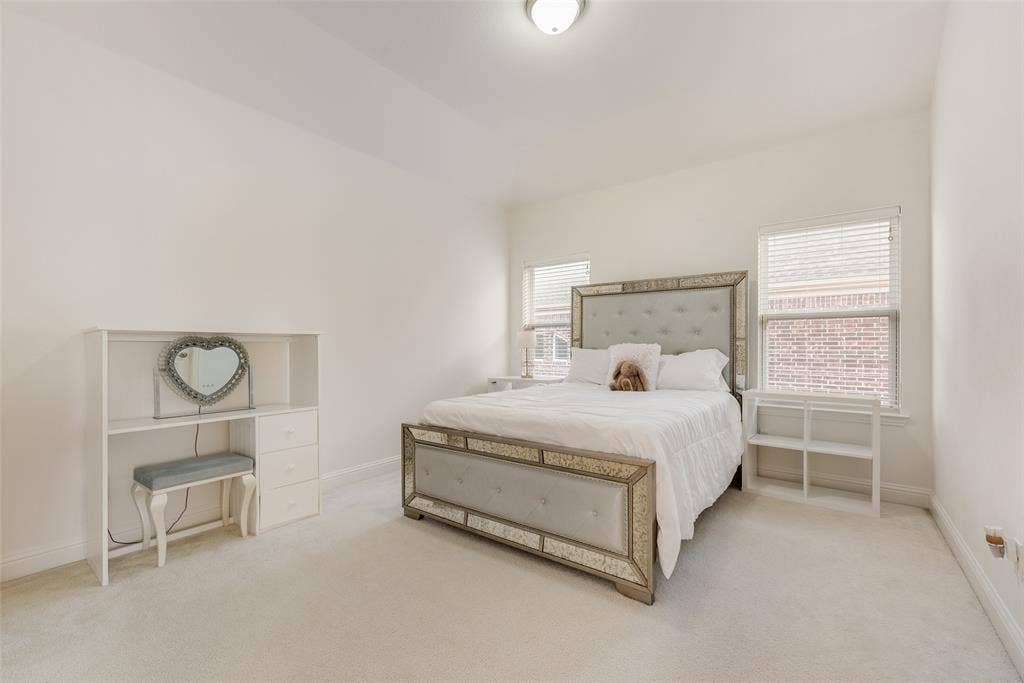 2408 Brisbane Lane, Plano, TX 75075 White walls and light-toned carpeting create an open atmosphere