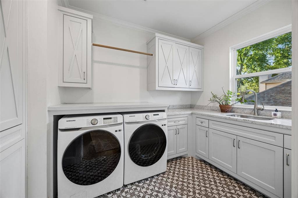 7318 Casa Loma Avenue, Dallas, TX 75214 Oversized sized laundry room with numerous plenty of storage cabinets for simple organization, a drip dry area and sink. Conveniently situated near the second floor bedrooms.