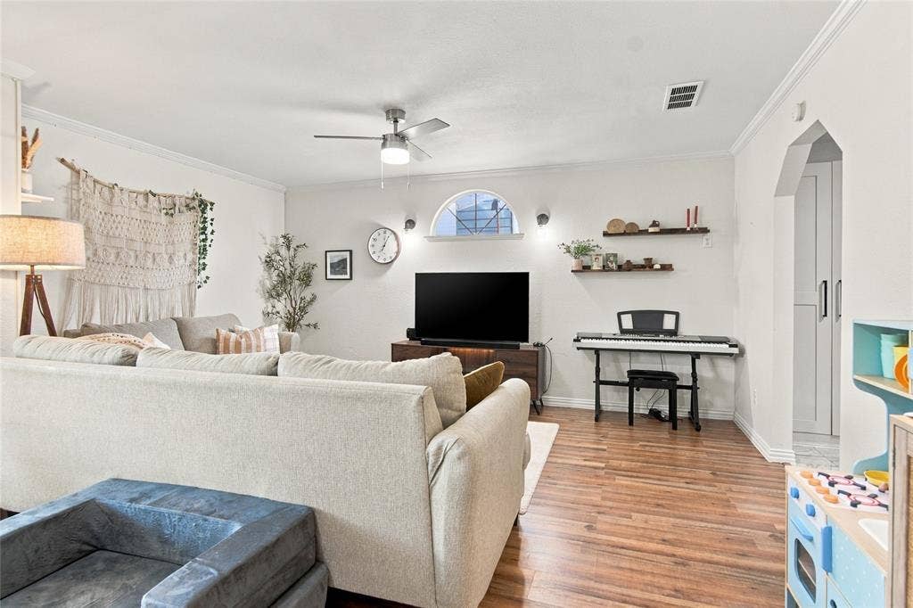 4720 Kyle Drive, Balch Springs, TX 75180 Wood-finish flooring throughout, complemented by a ceiling fan with integrated lighting