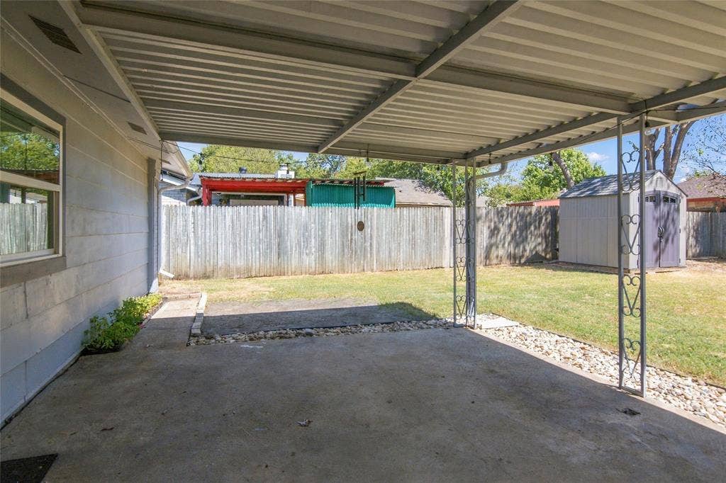 4720 Kyle Drive, Balch Springs, TX 75180 Covered patio with a concrete surface, metal support columns, and adjacent crushed stone landscaping