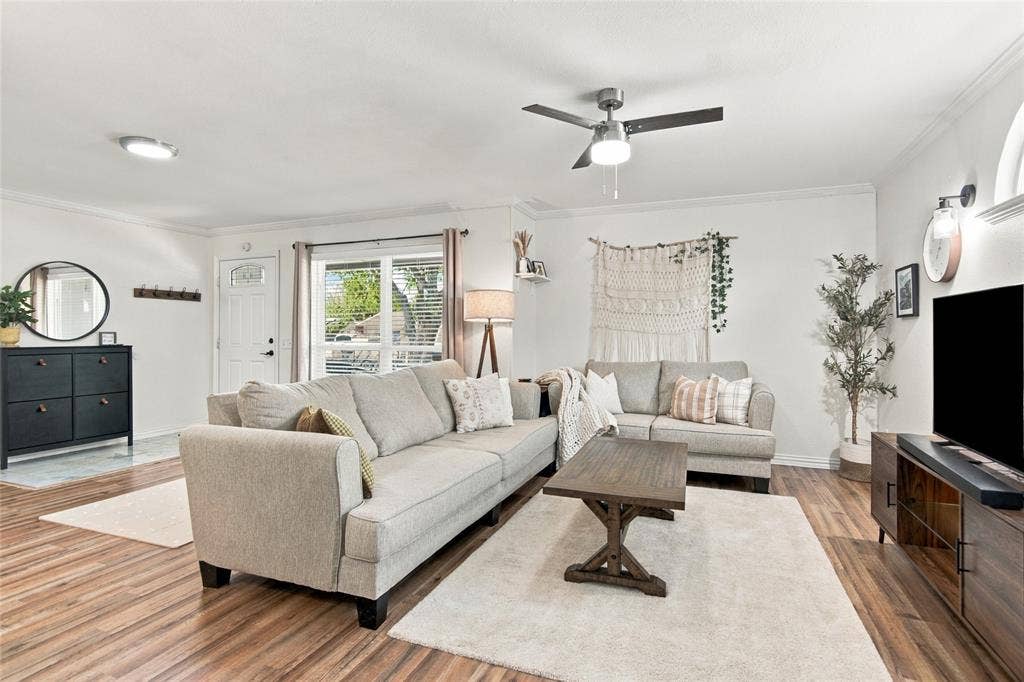 4720 Kyle Drive, Balch Springs, TX 75180 Wood-finish flooring throughout, complemented by a ceiling fan with integrated lighting