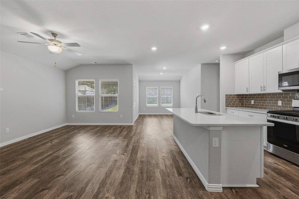 View from foyer of kitchen and living and dining - open concept