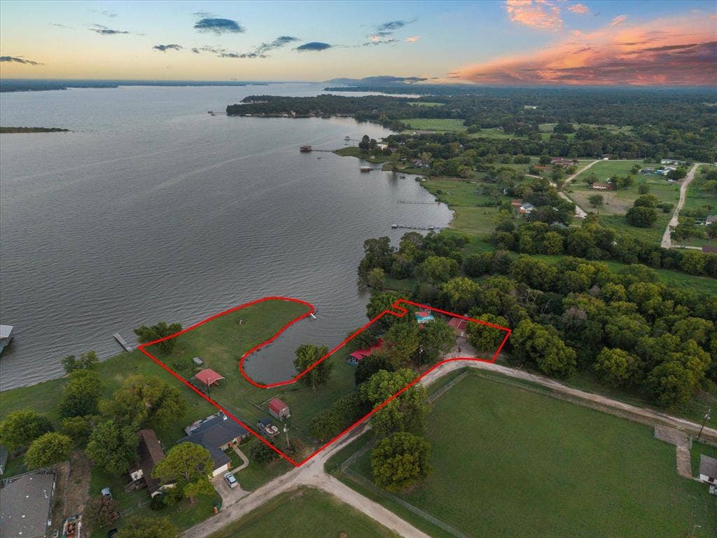 308 Causeway Cove, Seven Points, TX 75143 Waterfront property featuring extensive shoreline, private dock, and mature trees